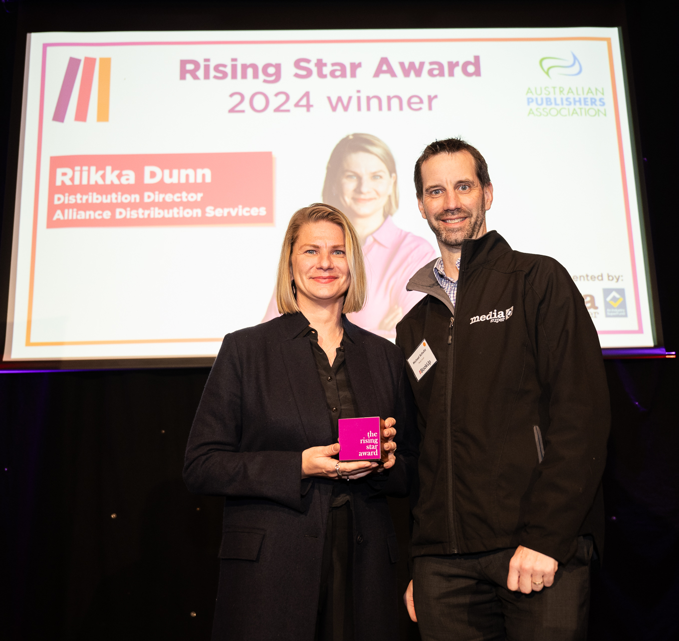 Riikka Dunn presented the award by Media Super’s Michael Schultz